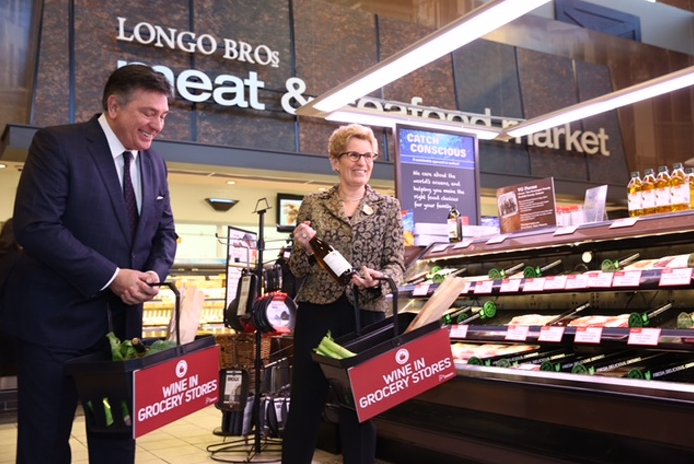 Mississauga South MPP and finance minister Charles Sousa and Ontario Premier Kathleen Wynne announce the sale of wine in grocery stores on Thursday, Feb. 18, 2016. (Photo: Government of Ontario)