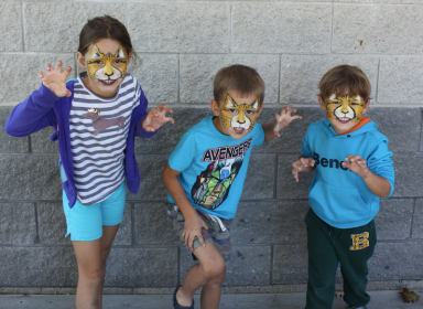 Port Credit residents Ella Tremblay, 7, and Oliver and Devin Tremblay, 5, show off their 'inner lions' at the Lakefront Promenade Marina BBQ on Saturday, Sept. 24, 2016. (Photo: Emma Schatochin/QEW South Post)